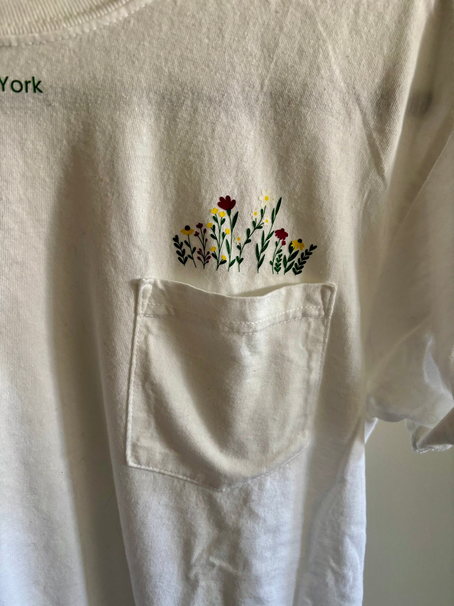 Stay Wild North Country New York Pocket Tee – White Comfort Colors Shirt with Wildflower Design